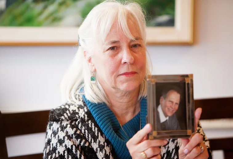 Rebecaa Brown holding picture of Kevin Brown